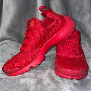 Red Nike slip on sneakers (SIZE 4Y)